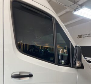 A truck with its door open and the window closed.