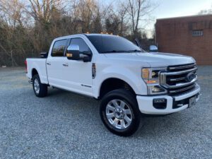 A white truck parked in the parking lot.