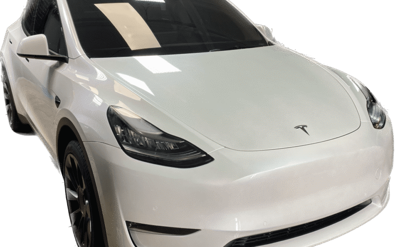 A white car is shown with its hood up.