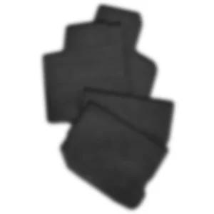 Stack of black car floor mats.
